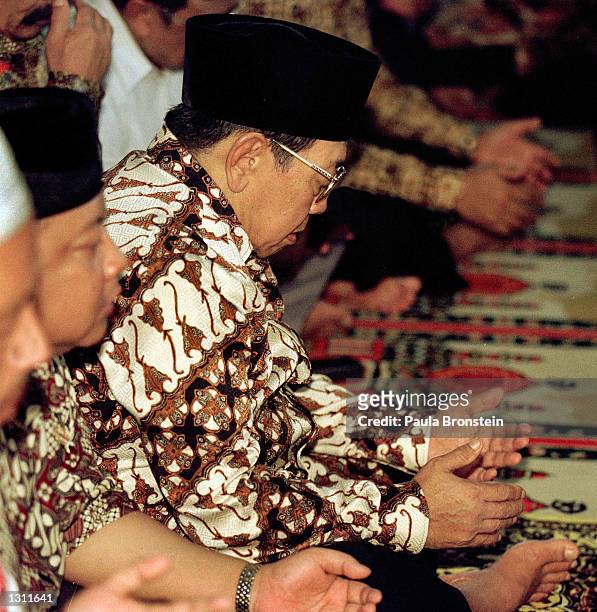 Indonesian President Abdurrahman Wahid, "Gus Dur", prays with members of his mosque June 1, 2001 in Ciganjur, South Jakarta. Wahid terminated key...
