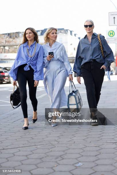 Fashion designer Sue Giers wearing black leggings by Norba, a black bag with gold details by Chanel, black sandals by Prada, a blue and white striped...