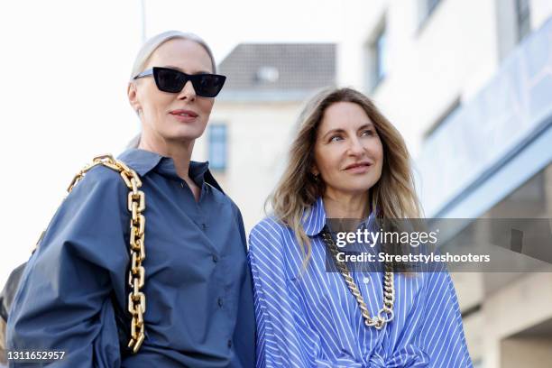 Best Ager Model and Influencer Petra van Bremen wearing a blue-grey blouse by SoSUE and sunglasses by Saint Laurent and fashion designer Sue Giers...