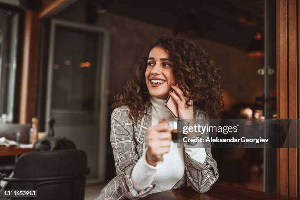 coffee time for smiling female beauty engaged in phone call - perfect stock pictures, royalty-free photos & images