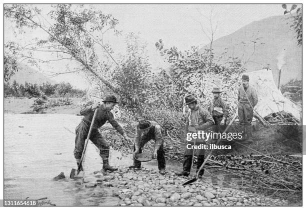 antique black and white photograph: klondike gold rush - panning stock illustrations