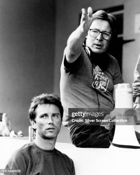 English filmmaker Alan Parker on the set of film 'Birdy', circa 1983.