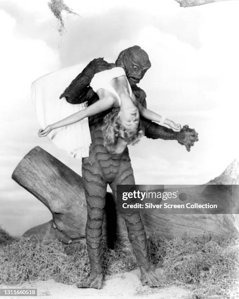 The Creature, 'Gillman', holding actress Julie Adams as 'Kay Lawrence' in the film 'Creature from the Black Lagoon', 1954.