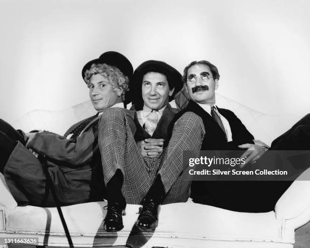 The three best known members of American comedy act the Marx Brothers, circa 1935; left to right, Chico , Harpo and Groucho Marx .