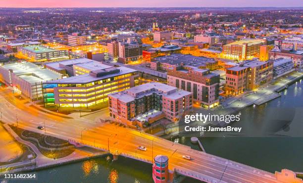 downtown green bay wisconsin city lights at twilight - v wisconsin stock pictures, royalty-free photos & images