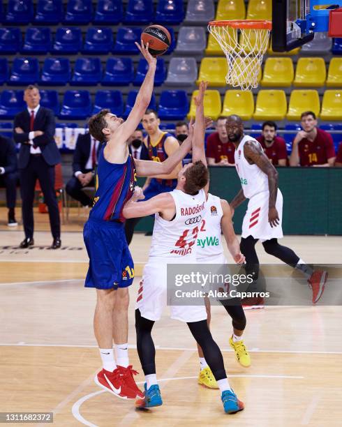 Pau Gasol, #16 of FC Barcelona scores over Leon Radosevic, #43 of FC Bayern Munich during the 2020/2021 Turkish Airlines EuroLeague Regular Season...