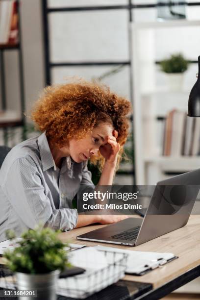female employee working in the business office. stock photo - bad employee stock pictures, royalty-free photos & images