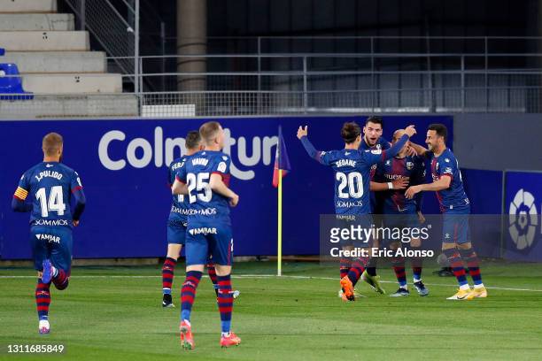 Sandro Ramirez of SD Huesca celebrates with teammates after scoring their team's second goal during the La Liga Santander match between SD Huesca and...