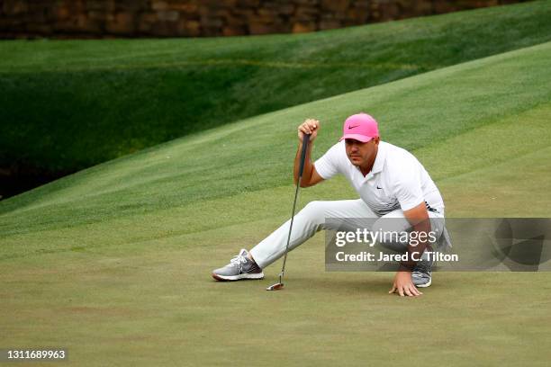 Brooks Koepka of the United States lines up a putt on the 11th green during the second round of the Masters at Augusta National Golf Club on April...