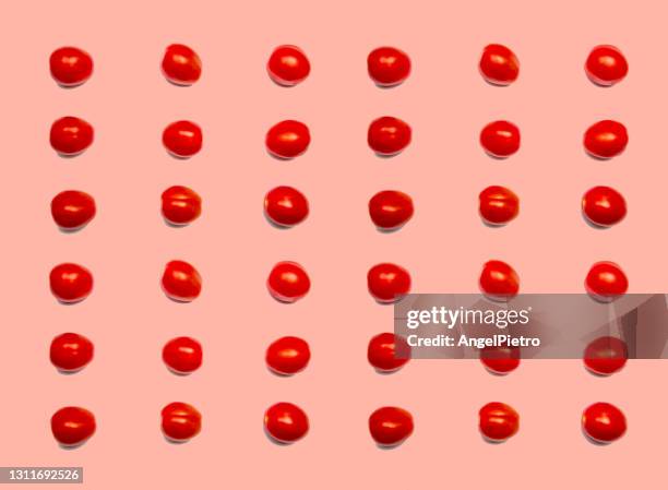 tomato pattern - a grid of vegetables - cherry tomato stock pictures, royalty-free photos & images