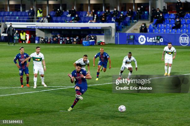 Rafa Mir of SD Huesca scores their team's third goal from the penalty spot during the La Liga Santander match between SD Huesca and Elche CF at...
