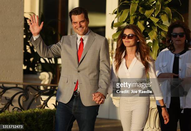 Rep. Matt Gaetz and his girlfriend, Ginger Luckey, arrive before he speaks during the "Save America Summit" at the Trump National Doral golf resort...