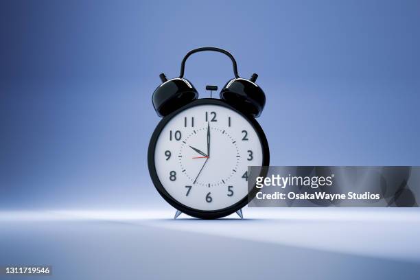 modern variation of black mechanical alarm clock with white face. hands showing 10 o'clock. - digital clock bildbanksfoton och bilder