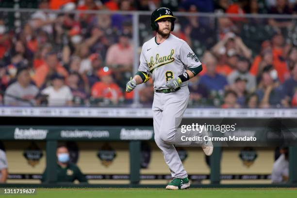 Jed Lowrie of the Oakland Athletics hits a home run during the fourth inning against the Houston Astros at Minute Maid Park on April 09, 2021 in...