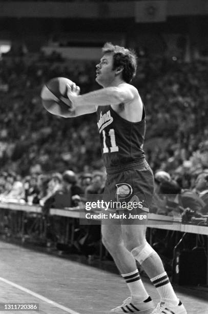 Indiana Pacers guard Bill Keller passes the ball inbounds from the sideline during an ABA basketball game against the Denver Nuggets at McNichols...