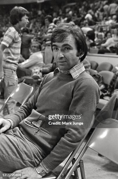 Denver Nuggets general manager Carl Scheer sits on a team chair at courtside prior to an ABA basketball game against the Indiana Pacers at McNichols...