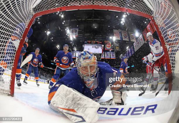 Semyon Varlamov of the New York Islanders reacts following a second period goal by Alexis Lafreniere of the New York Rangers at Nassau Coliseum on...