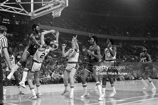 Indiana Pacers forward Billy Knight drives into Denver Nuggets forward Bobby Jones under the basket during an ABA basketball game at McNichols Arena...