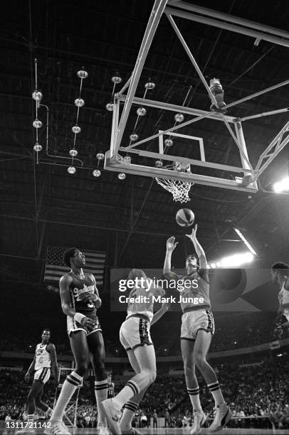 Denver Nuggets forward Bobby Jones catches the ball as it comes through the net during an ABA basketball game against the Indiana Pacers at McNichols...