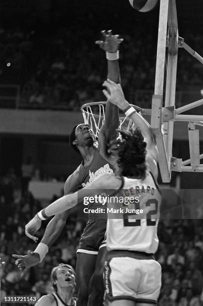 Indiana Pacers forward Dan Roundfield attempts to block a layup by Denver Nuggets forward Gus Gerard during an ABA basketball game at McNichols Arena...