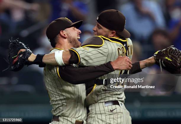 Joe Musgrove of the San Diego Padres celebrates with Victor Caratini after pitching a no-hitter against the Texas Rangers at Globe Life Field on...