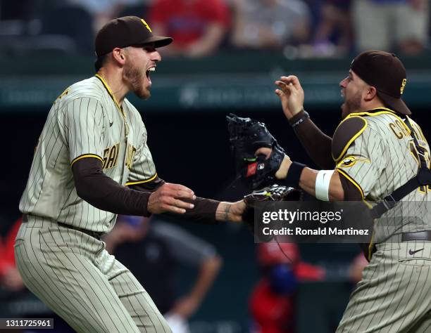 Joe Musgrove of the San Diego Padres celebrates with Victor Caratini after pitching a no-hitter against the Texas Rangers at Globe Life Field on...