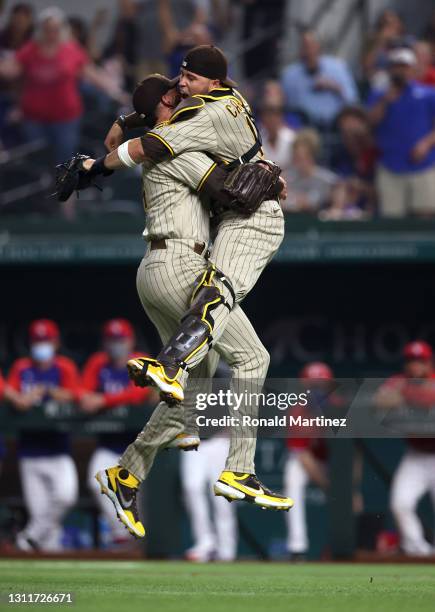 Joe Musgrove of the San Diego Padres celebrates with Victor Caratini after pitching a no-hitter against the Texas Rangers at Globe Life Field on...