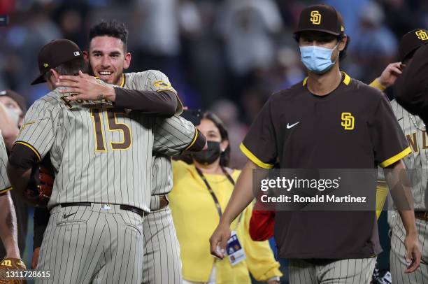 Joe Musgrove of the San Diego Padres celebrates with Drew Pomeranz after pitching a no-hitter against the Texas Rangers at Globe Life Field on April...