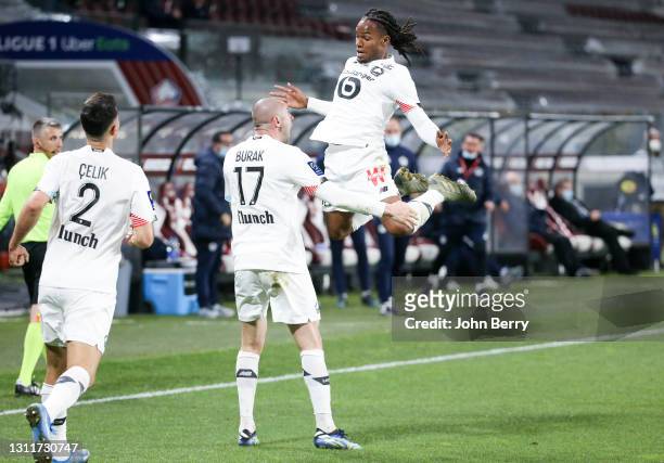 Burak Yilmaz of Lille celebrates his goal with Renato Sanches during the Ligue 1 match between FC Metz and Lille OSC at Stade Saint-Symphorien on...