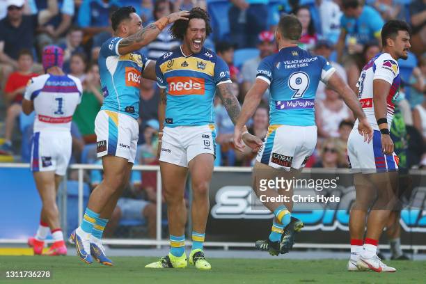 Kevin Proctor of the Titans celebrates a try during the round five NRL match between the Gold Coast Titans and the Newcastle Knights at Cbus Super...