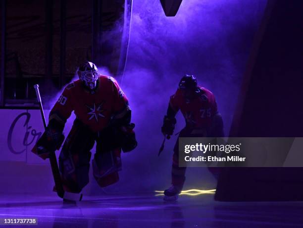 Robin Lehner and Ryan Reaves of the Vegas Golden Knights take to the ice for a game against the Arizona Coyotes at T-Mobile Arena on April 9, 2021 in...