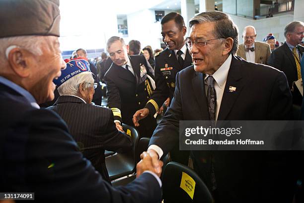 Former Transportation Secretary Norman Mineta greets Japanese-American veterans of the 100th Infantry Battalion, 442 Regimental Combat Team, and the...