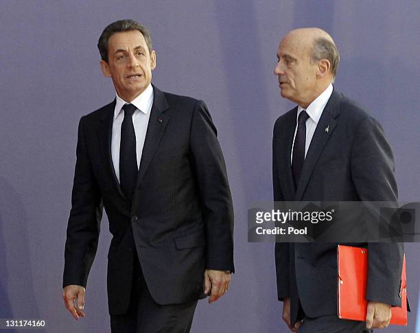 French President Nicolas Sarkozy and French Foreign Minister Alain Juppe arrive for talks with EU and IMF representatives on November 2, 2011 in...