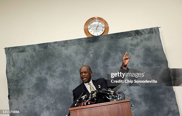 Republican presidential candidate and former CEO of Godfather's Pizza Herman Cain participates in a discussion with members of the Congressional...