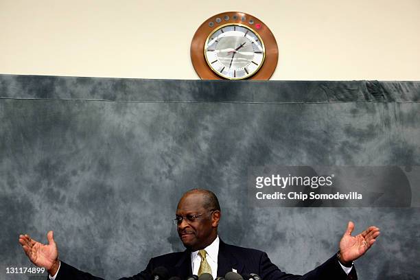 Republican presidential candidate and former CEO of Godfather's Pizza Herman Cain participates in a discussion with members of the Congressional...