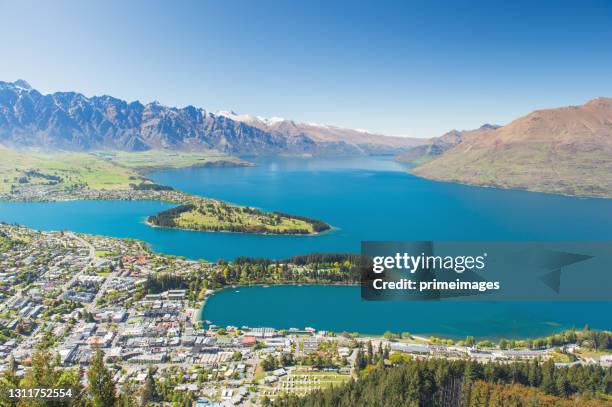 blue lake and sky in residence housing business area in queenstown new zealand expensive area in south island - wanaka imagens e fotografias de stock