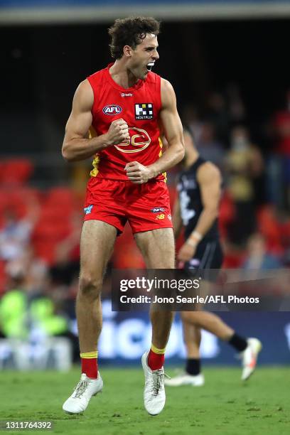 Ben King of the Suns celebrates a goal during the round four AFL match between the Gold Coast Suns and the Carlton Blues at Metricon Stadium on April...