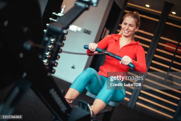 perfect shape in progress - rowing machine stock pictures, royalty-free photos & images