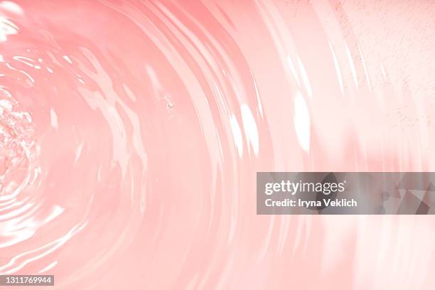 abstract background with moisturizing cleansing cosmetic gel, pure water or face serum, essential oil with oxygen aqua bubbles and waves. - oil liquid ストックフォトと画像