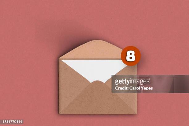 brown  envelope with notification-email concept - icons for email mail and phone stock-fotos und bilder