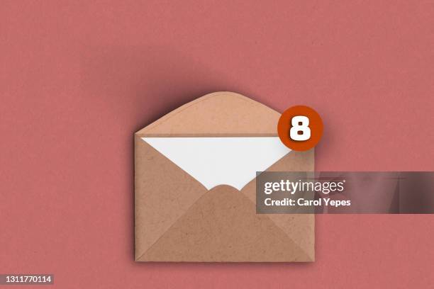 brown  envelope with notification-email concept - inbox filing tray stockfoto's en -beelden