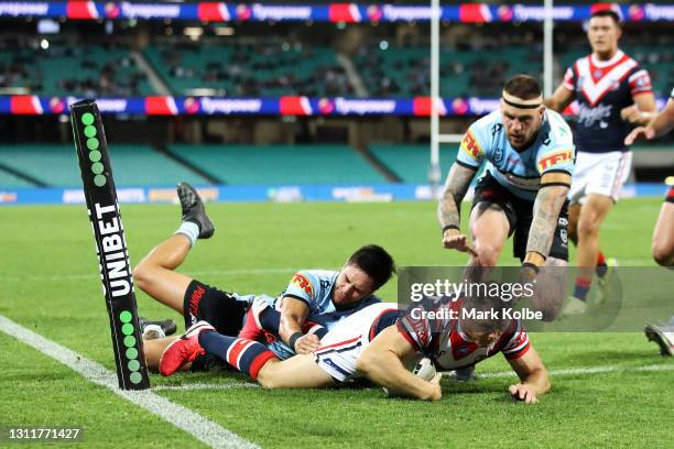 Brett Morris of the Roosters scores a try during the round five NRL match between the Sydney Roosters and the Cronulla Sharks at Sydney Cricket...