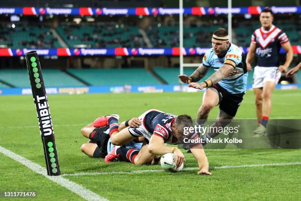 Brett Morris of the Roosters scores a try during the round five NRL match between the Sydney Roosters and the Cronulla Sharks at Sydney Cricket...