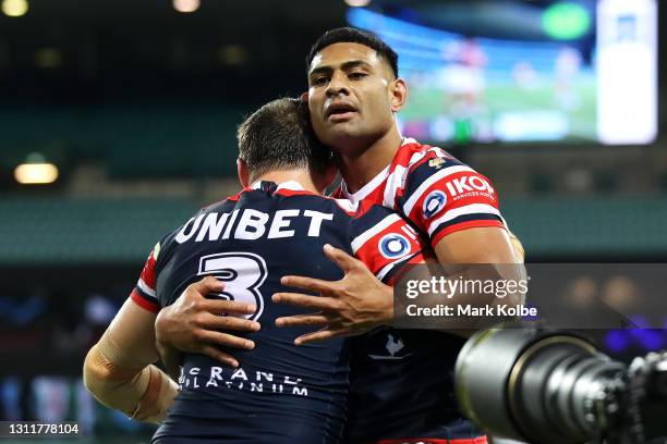 Daniel Tupou of the Roosters celebrates with his team mateJosh Morris of the Roosters after scoring a try during the round five NRL match between the...