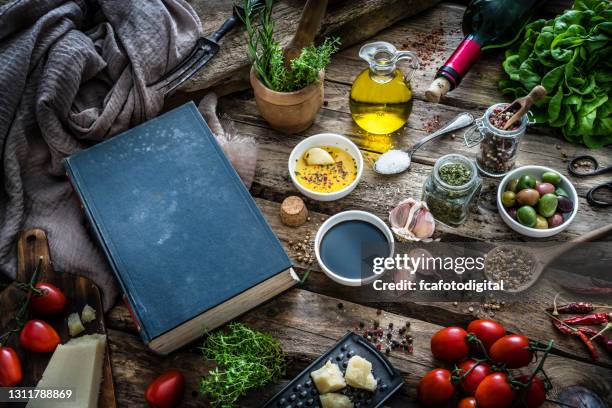 cookbook, spices and ingredients on rustic table - cookbook stock pictures, royalty-free photos & images