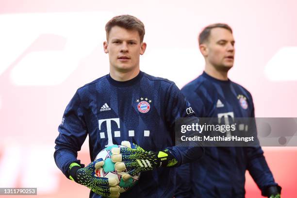 Alexander Nuebel of FC Bayern Muenchen and Manuel Neuer of FC Bayern Muenchen looks on during the Bundesliga match between FC Bayern Muenchen and 1....