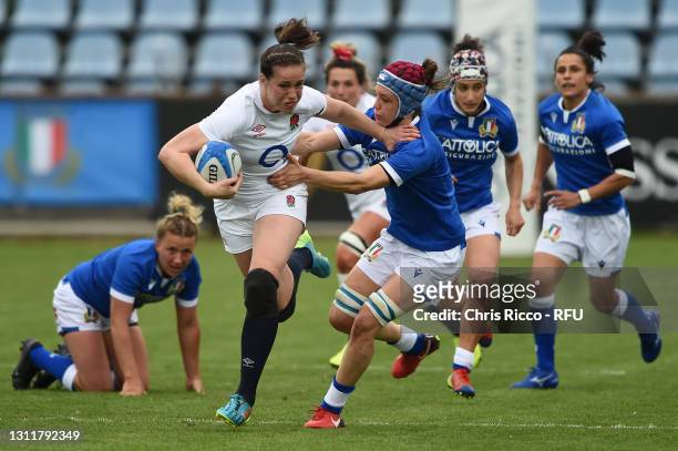Emily Scarratt of England hands off Elisa Giordano of Italy and runs through to score their first try during the Women's Six Nations match between...