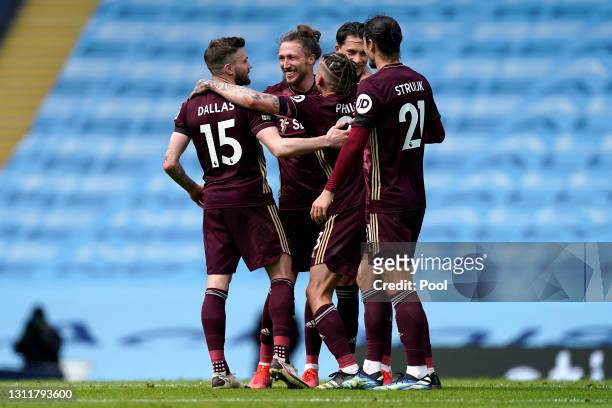Stuart Dallas, Luke Ayling, Kalvin Phillips and Pascal Struijk of Leeds United celebrate after the Premier League match between Manchester City and...