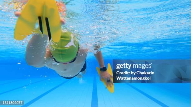 underwater swimming pool background - a man enjoy swimming in a beautiful swimming pool. - swimming lanes stock pictures, royalty-free photos & images
