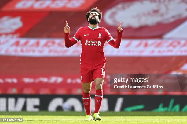 Mohamed Salah of Liverpool celebrates after scoring their team's first goal during the Premier League match between Liverpool and Aston Villa at...